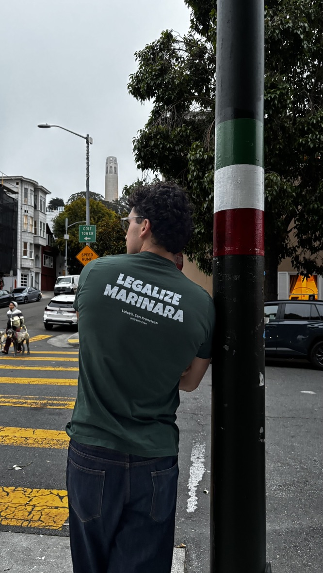 The forest green tee worn on the street below Coit Tower