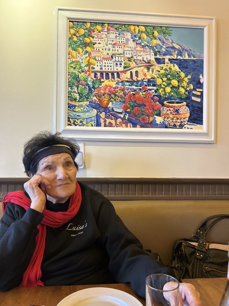 In the dining room under the Amalfi painting, in a Luisa's crewneck
