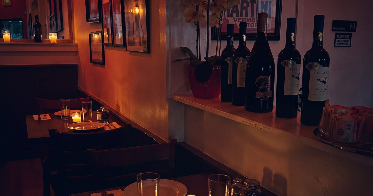 Inside the room — orchids, framed posters and the wine shelf